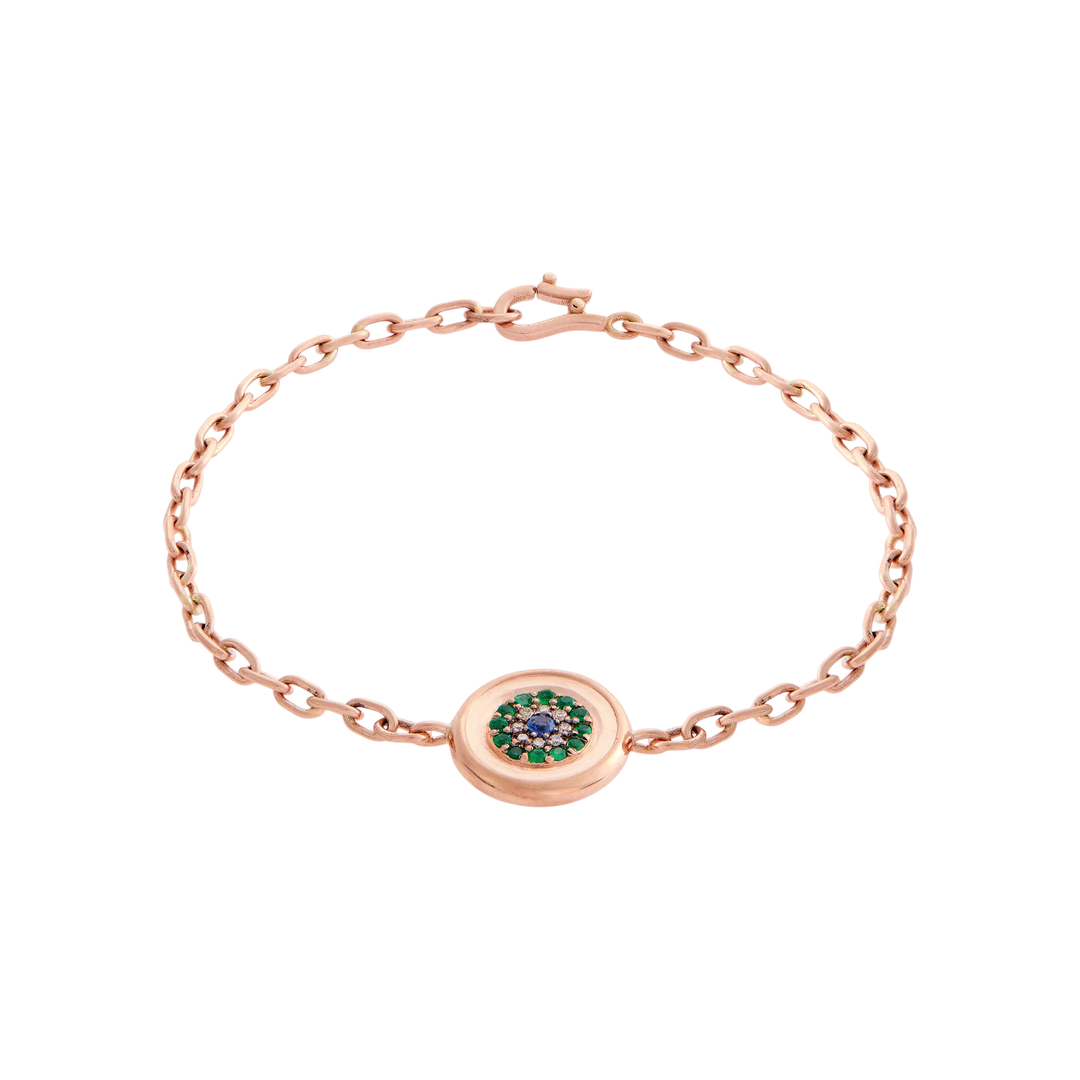 Ileana Makri 14k rose gold chain bracelet featuring a reversible round eye motif with emeralds and champagne diamonds.