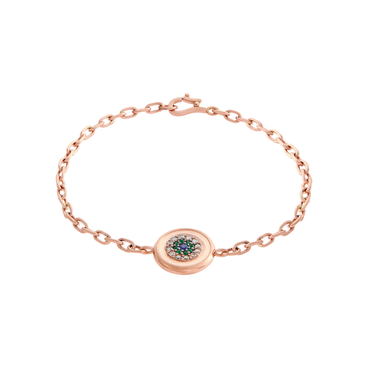 Ileana Makri 14k rose gold chain bracelet featuring a reversible round eye motif with emeralds and champagne diamonds.