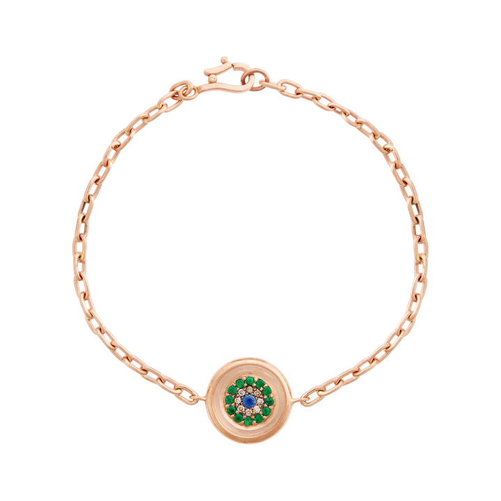 Ileana Makri 14k rose gold chain bracelet featuring a reversible round eye motif with emeralds and blue sapphire.