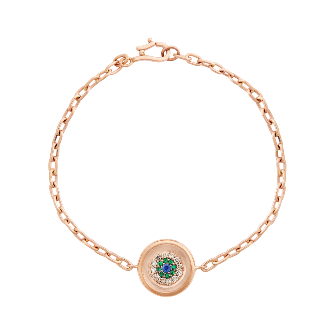 Ileana Makri rose gold bracelet featuring a reversible round eye motif with emeralds, champagne diamonds, and sapphire.