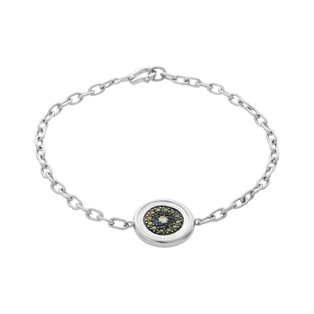 Ileana Makri double-sided eye bracelet in 18k white gold with green diamonds, blue sapphires, and a white diamond.