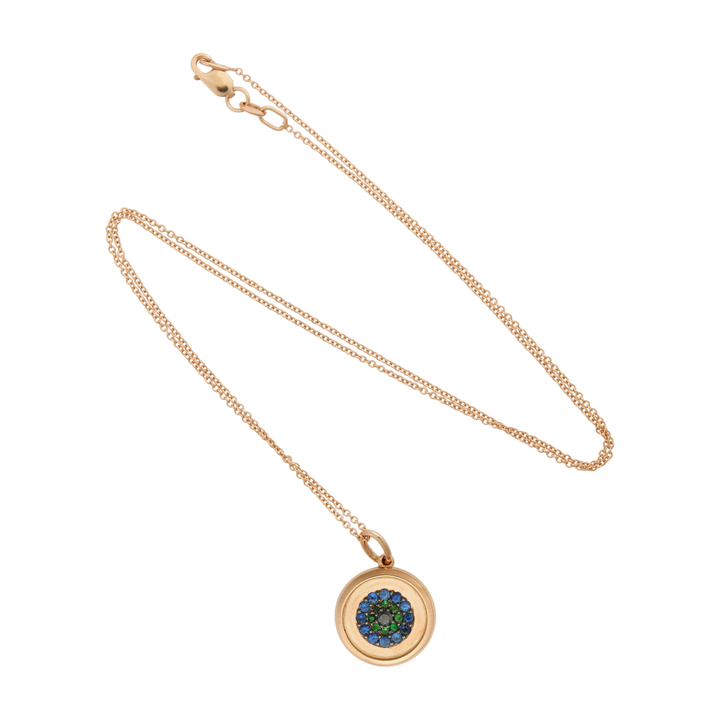 Ileana Makri round eye pendant in 18k rose gold with blue sapphire, tsavorite, and black diamond pavé detailing.