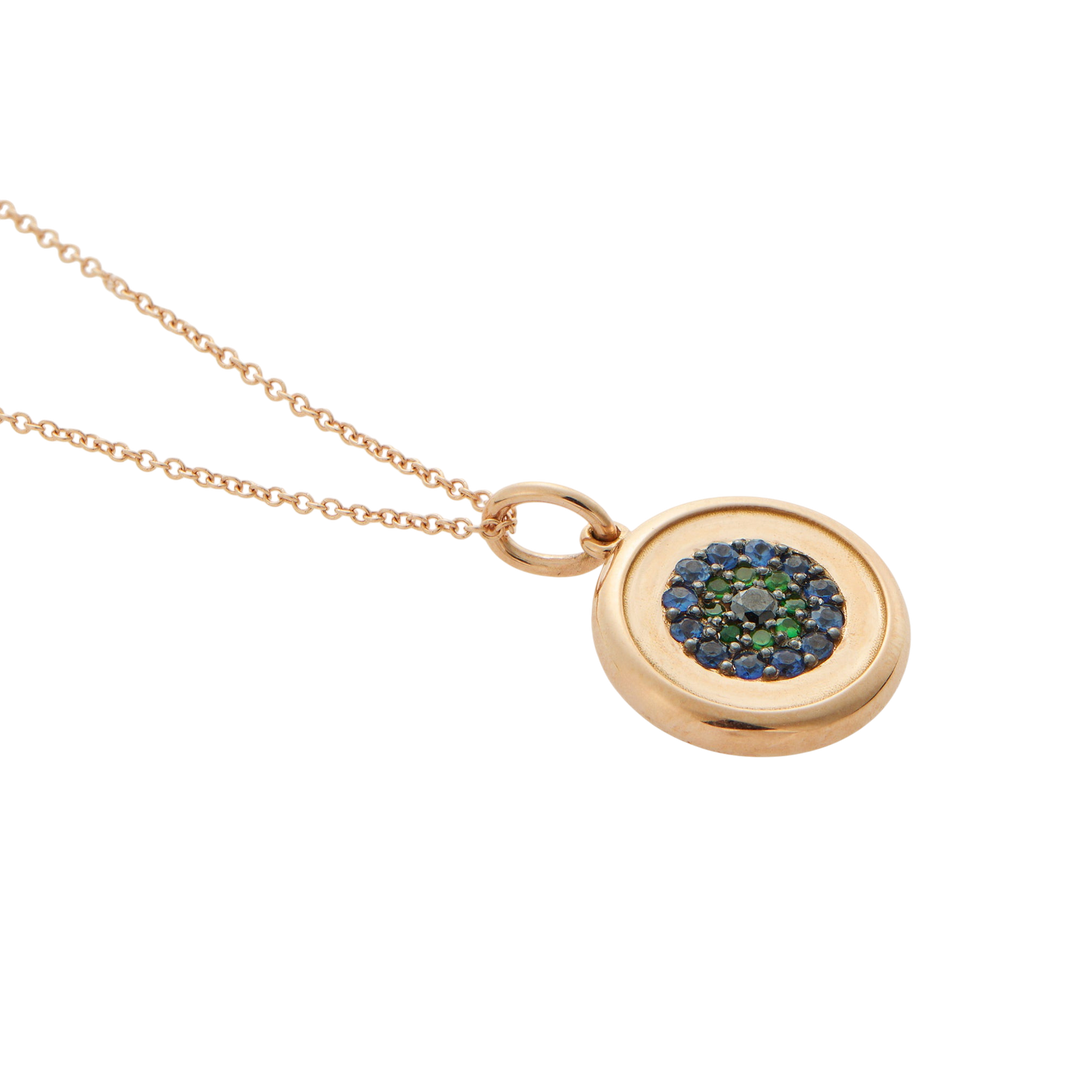 Ileana Makri round eye pendant in 18k rose gold with blue sapphires, green tsavorites, and a central black diamond.