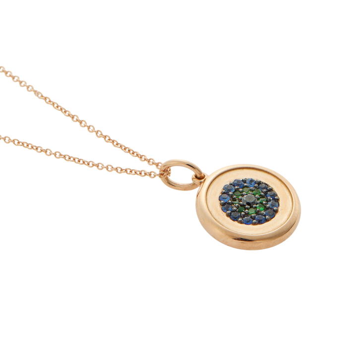 Ileana Makri round eye pendant in 18k rose gold with blue sapphires, green tsavorites, and a central black diamond.