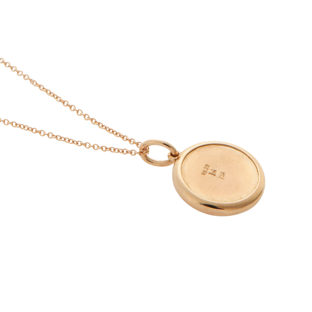 Ileana Makri round eye pendant in 18k rose gold, showing the smooth polished back with hallmark engravings.