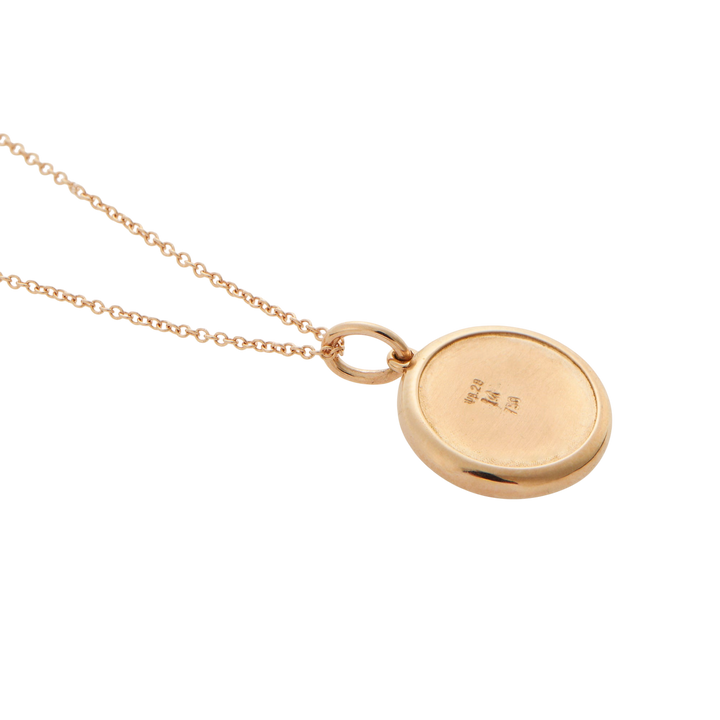 Ileana Makri round eye pendant in 18k rose gold, showing the smooth polished back with hallmark engravings.