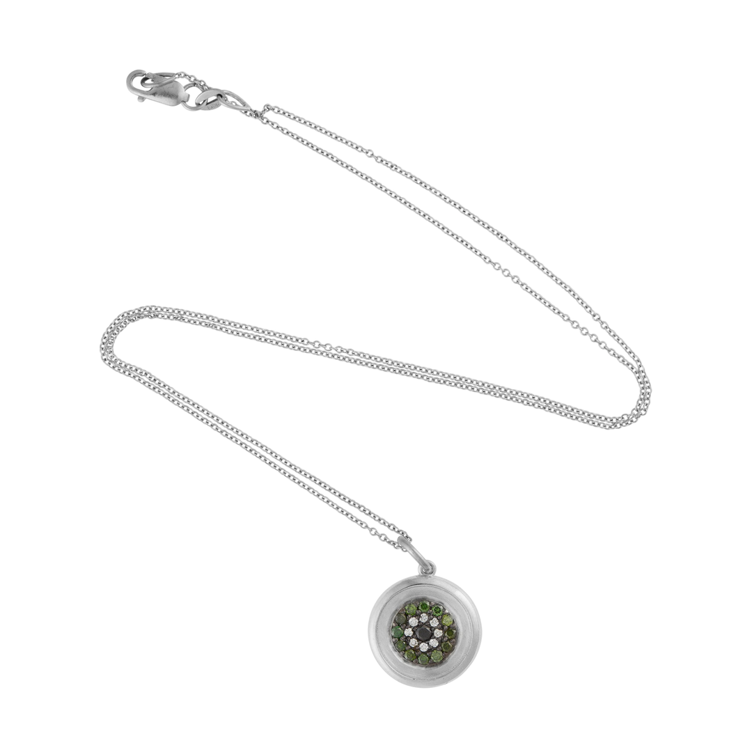 Ileana Makri round eye pendant in 18k white gold with pavé-set green, white, and black diamonds on a delicate chain.