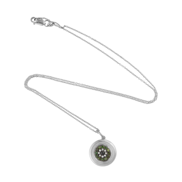 Ileana Makri round eye pendant in 18k white gold with pavé-set green, white, and black diamonds on a delicate chain.