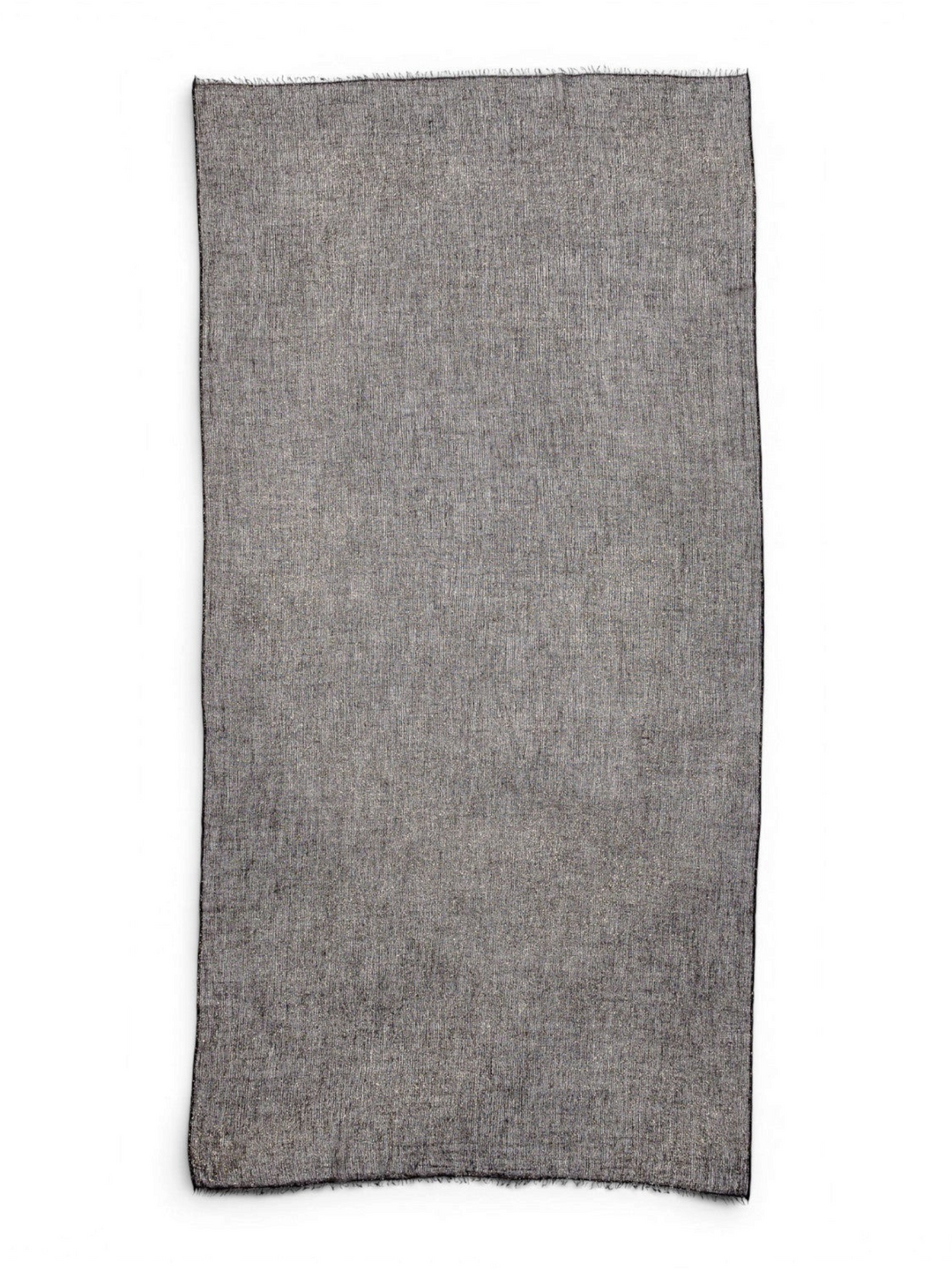 Ileana Makri Tamarindo black cashmere scarf with a delicate shimmer and frayed edges, flat lay view.