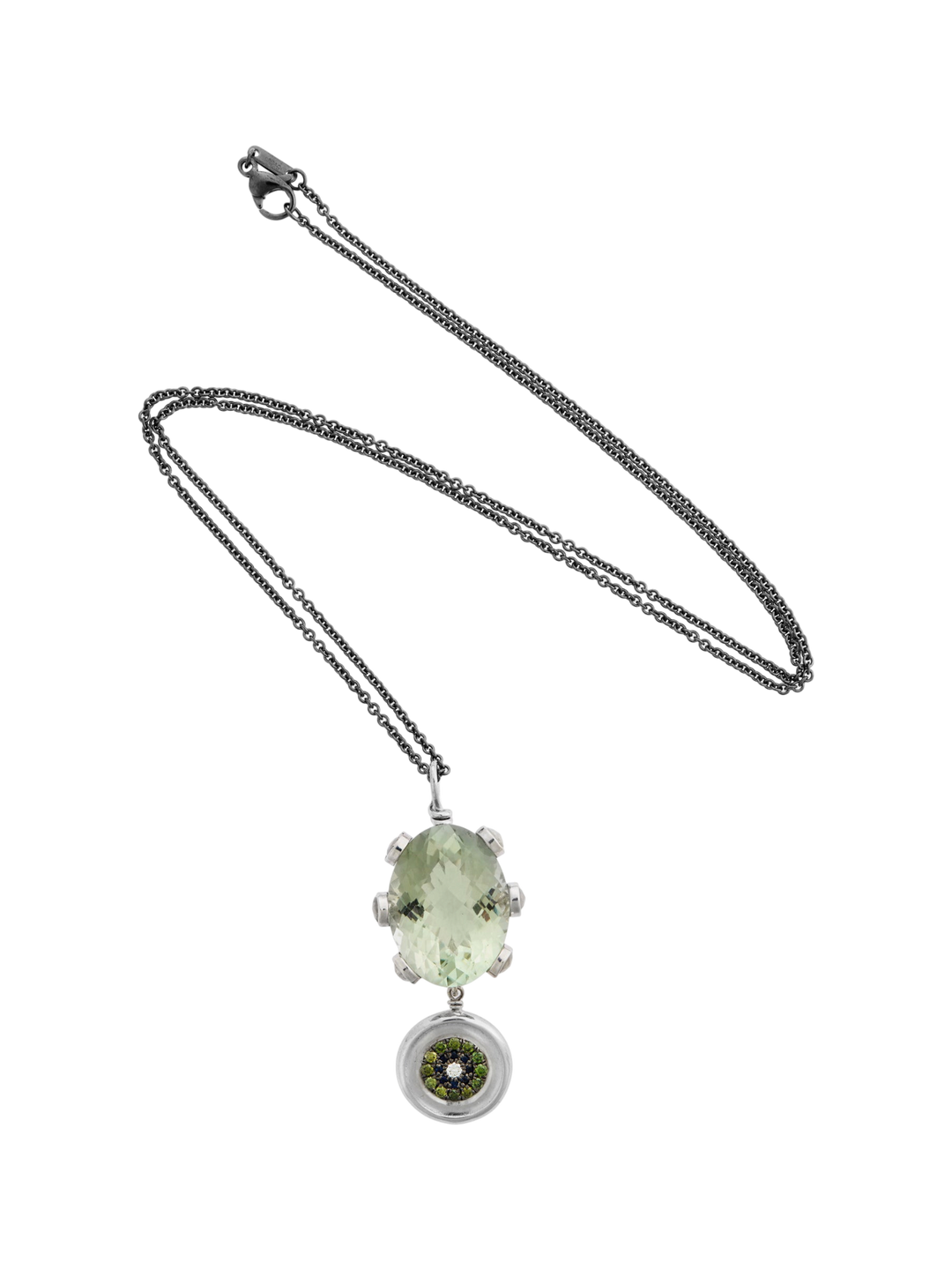 Ileana Makri double eye pendant featuring an oval green amethyst, green diamonds, and sapphires on a steel chain.