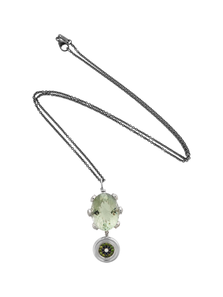 Ileana Makri double eye pendant featuring an oval green amethyst, green diamonds, and sapphires on a steel chain.