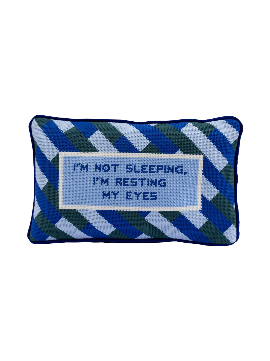 Ileana Makri needlepoint pillow featuring a blue geometric pattern and the text I'm not sleeping, I'm resting my eyes.