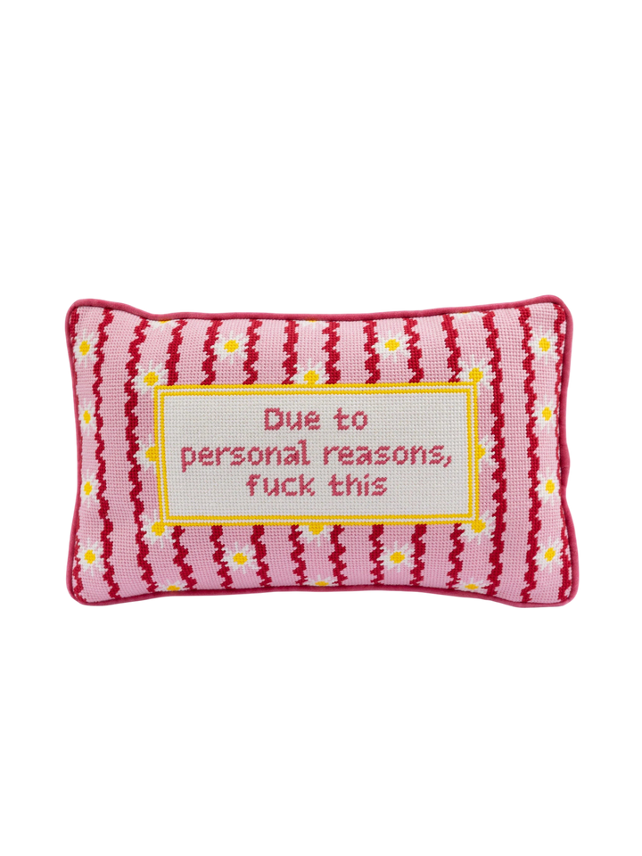 Ileana Makri needlepoint pillow featuring a pink floral pattern and the phrase Due to personal reasons, fuck this.
