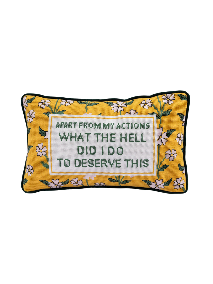 Ileana Makri needlepoint pillow featuring a yellow floral pattern and the embroidered phrase What the Hell Did I Do
