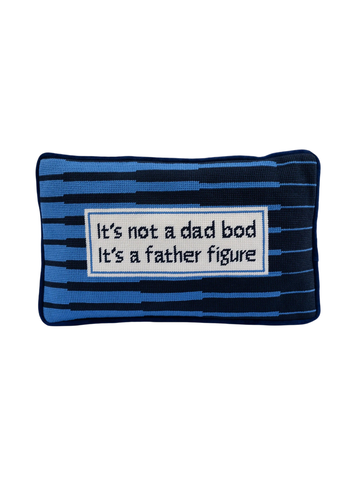 Ileana Makri Father Figure needlepoint pillow with blue striped pattern and cheeky text on a white rectangular patch