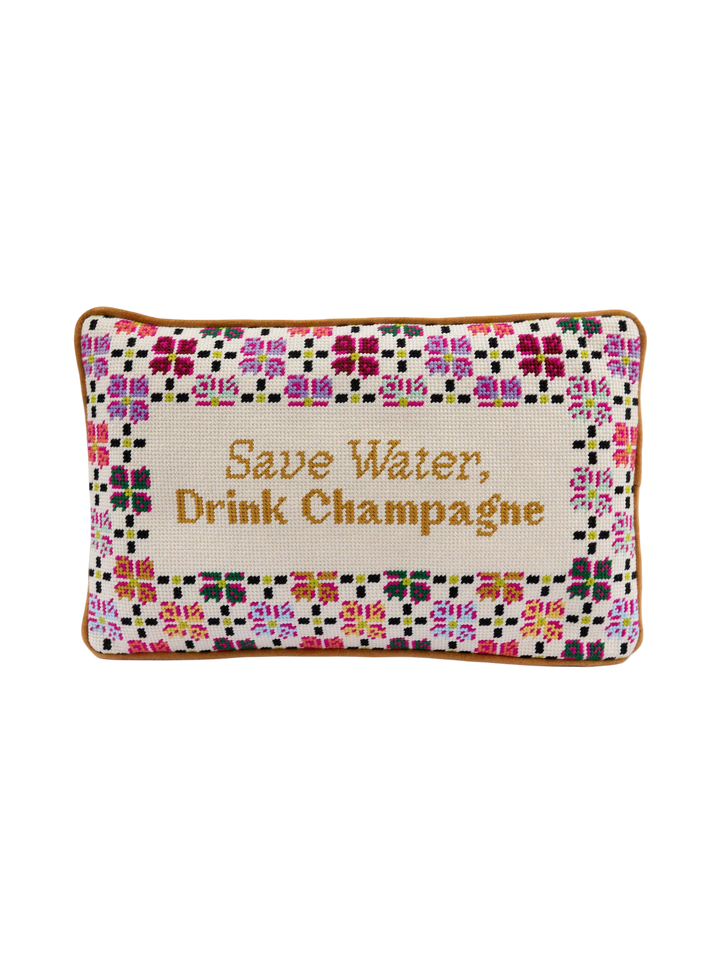 Ileana Makri rectangular needlepoint pillow featuring a floral border and the phrase Save Water, Drink Champagne.