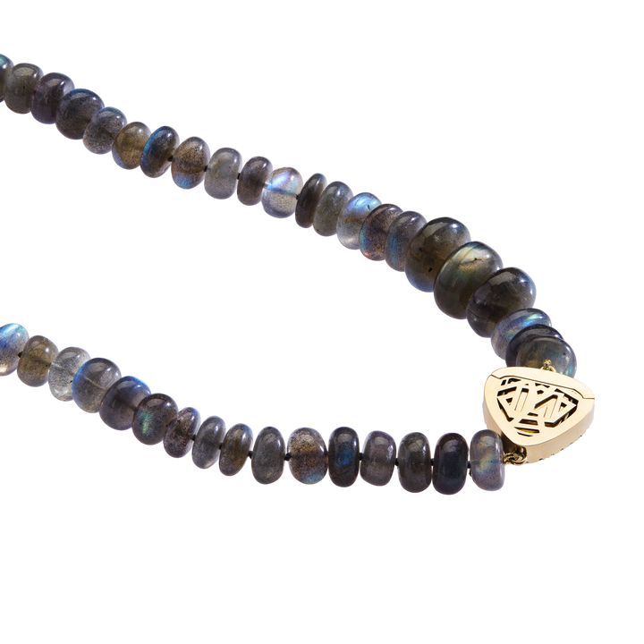 Ileana Makri labradorite bead necklace with a sculptural 18k yellow gold clasp featuring intricate geometric detail.