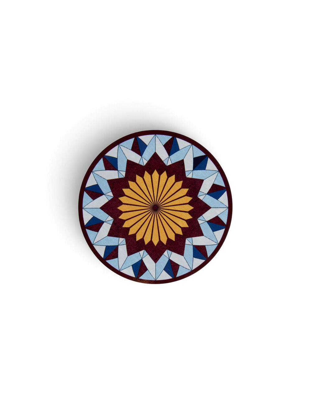 Ileana Makri Lotus of Life circular coaster featuring a blue and yellow geometric mosaic pattern with a cork backing.