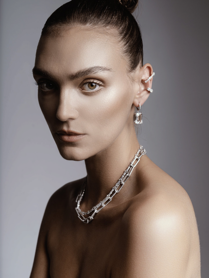 Ileana Makri Royal Crown white gold hoops with white topaz and diamond accents worn by a model with a matching necklace