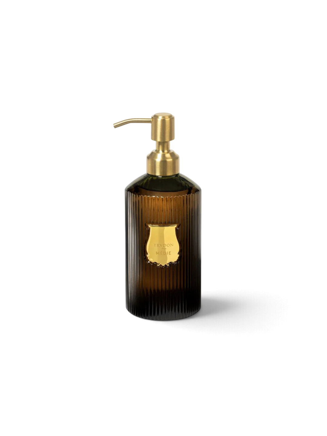 Ileana Makri Trudon Médie scented hand soap in a ribbed dark glass bottle with a gold pump dispenser