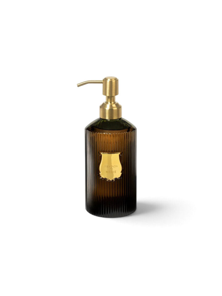 Ileana Makri Trudon Médie scented hand soap in a ribbed dark glass bottle with a gold pump dispenser