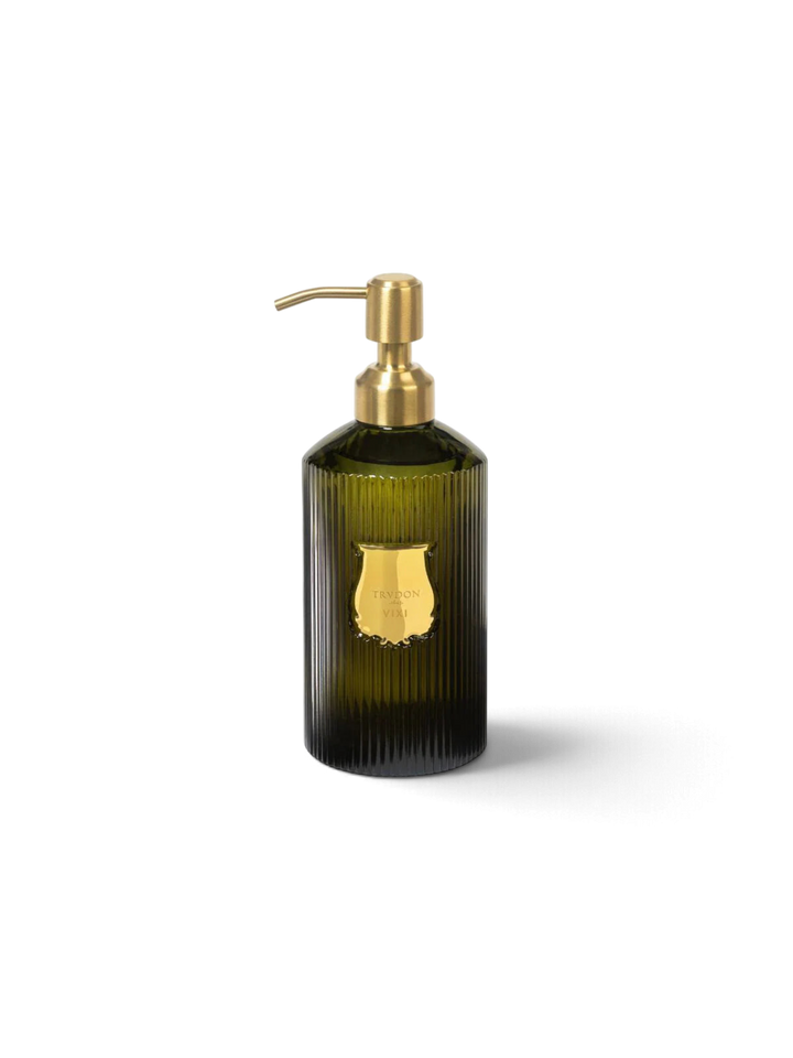Ileana Makri Trudon Vixi scented hand soap in a ribbed dark green glass bottle with a gold pump dispenser.