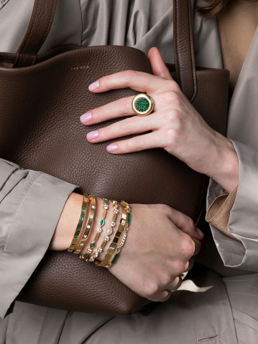 Ileana Makri Emerald Navette Stream Bracelet in satin-finished 18k yellow gold with diamonds worn on a wrist