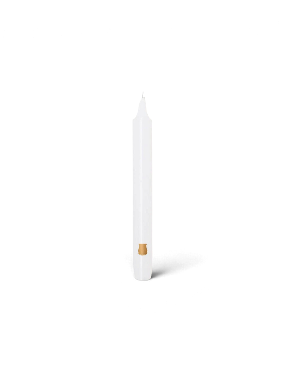 Ileana Makri white tapered Madeleine candle with a small gold emblem detail on a plain white background