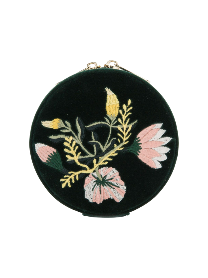 Ileana Makri Zoe round travel jewelry case in forest green velvet with elegant floral embroidery and gold zip detail.