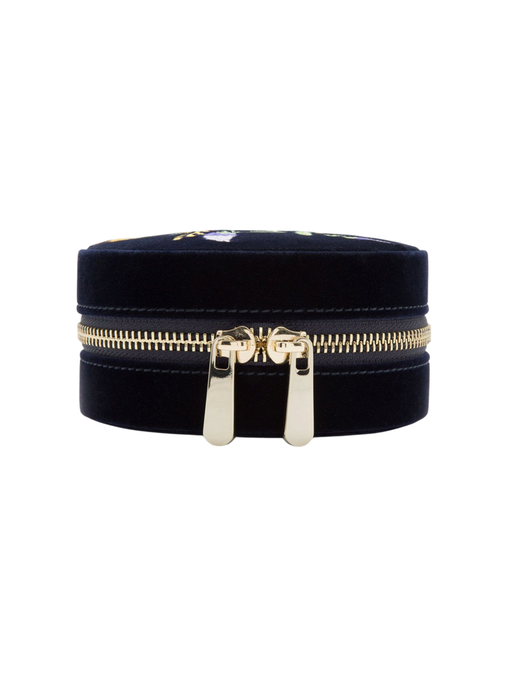 Ileana Makri Zoe travel round jewelry case in indigo velvet with gold zipper and floral embroidery detail.