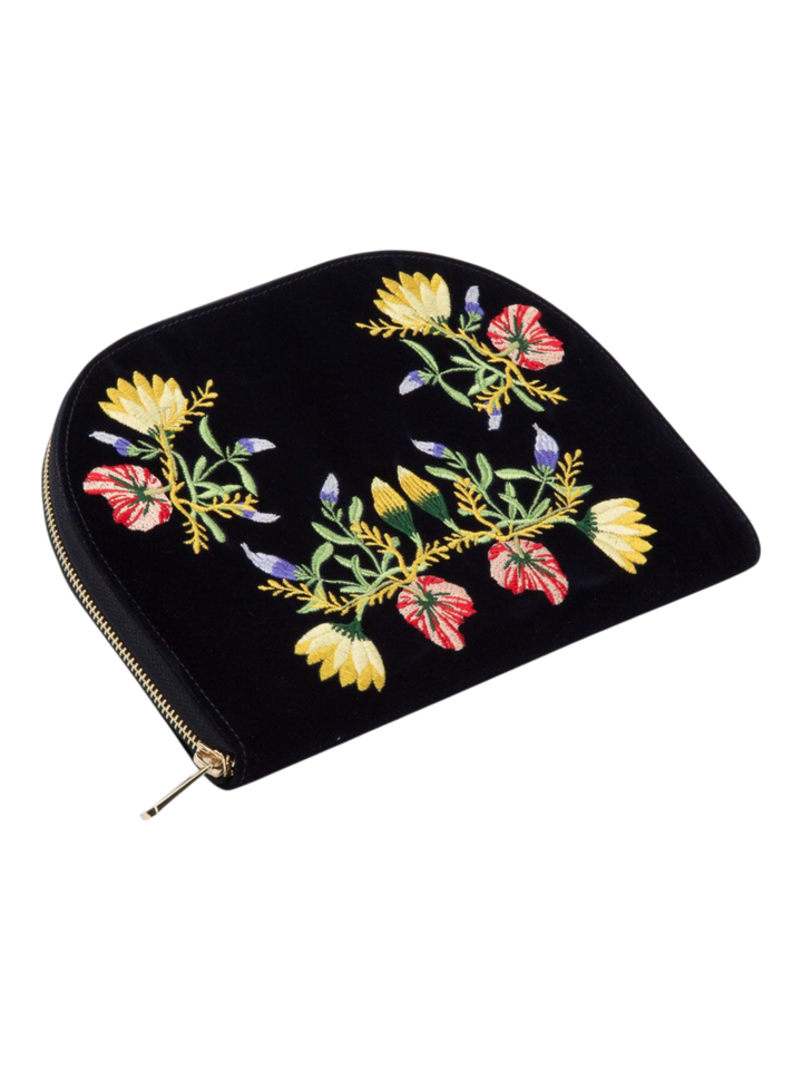 Ileana Makri Zoe Portfolio in indigo velvet featuring intricate floral embroidery and a gold zip closure.