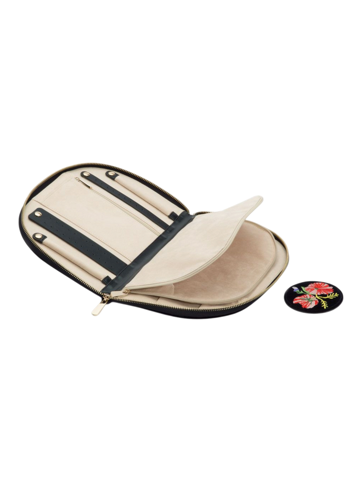 Ileana Makri Zoe Portfolio Indigo velvet jewelry organizer with cream interior, zip pockets, and floral patch accessory.