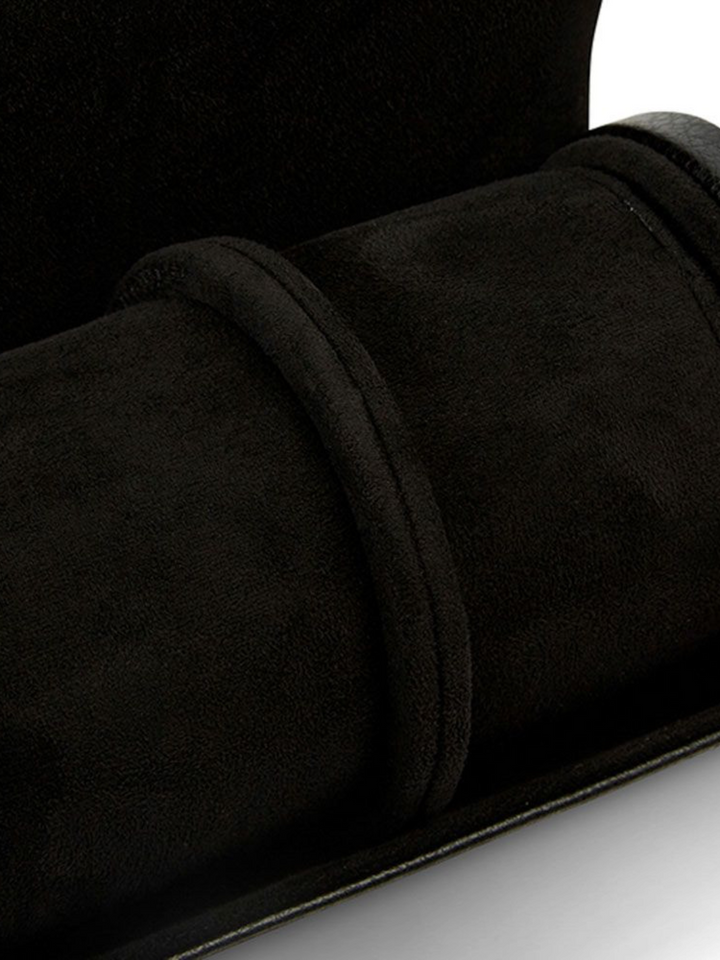 Ileana Makri black pebble grain leather triple watch roll with soft suede interior and gold hardware details.