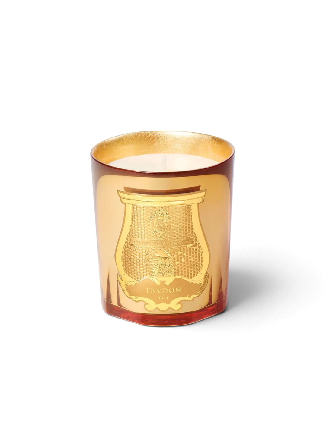 Ileana Makri Trudon Galerie des flammes candle in a gold-tinted glass vessel with an ornate embossed crest