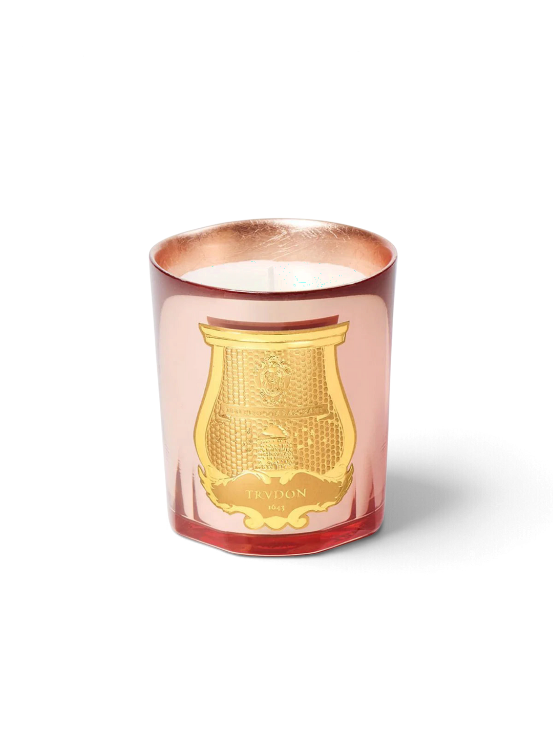 Ileana Makri Trudon Nazareth scented candle in a rose-tinted glass vessel with a gold embossed emblem