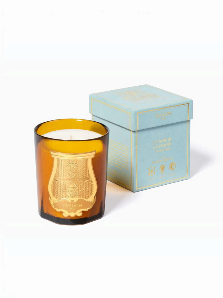Ileana Makri Cire Trudon Altair scented candle in an amber glass vessel with a gold emblem and matching light blue box