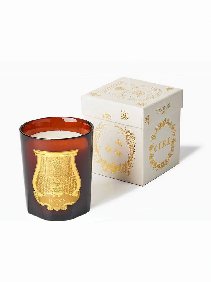 Ileana Makri Trudon Cire beeswax candle in amber glass with gold emblem and matching decorative gift box