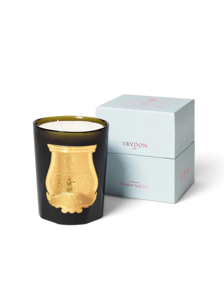 Ileana Makri Gabriel Gourmand scented candle in a dark green glass vessel with a gold emblem and light blue box.