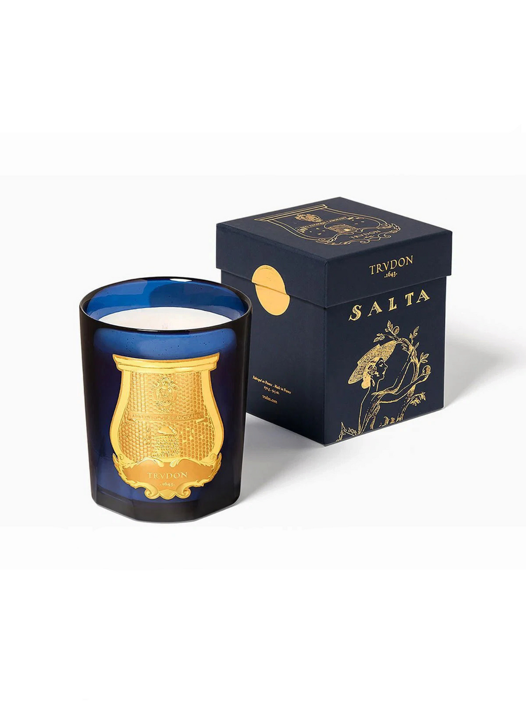Ileana Makri Salta grapefruit scented candle in a deep blue glass vessel with a gold emblem and matching gift box.