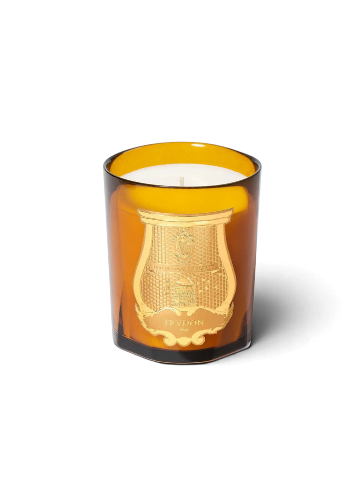 Ileana Makri Cire Trudon Altair scented candle in an amber glass vessel with a gold embossed crest label